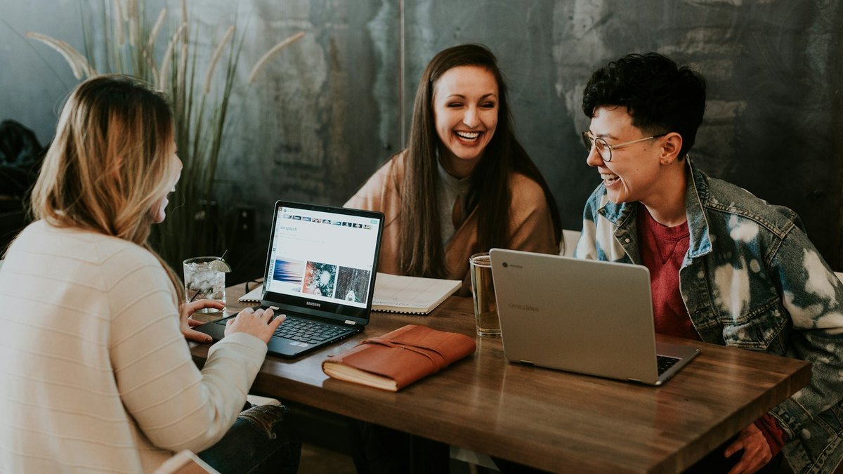 Small business owner planning an email marketing calendar on a laptop.