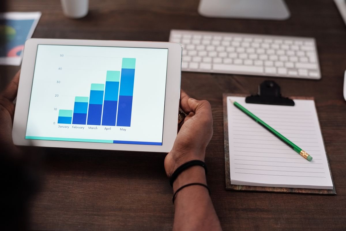 Business owner reviewing website notes and conversion priorities at a desk.