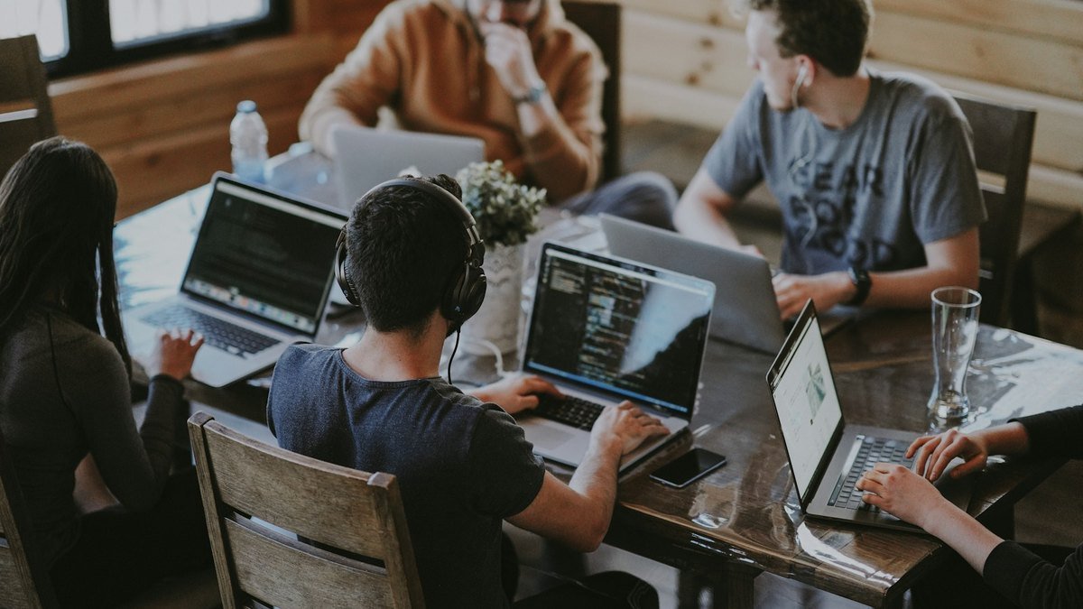Team planning lead follow-up steps during a small business strategy meeting.