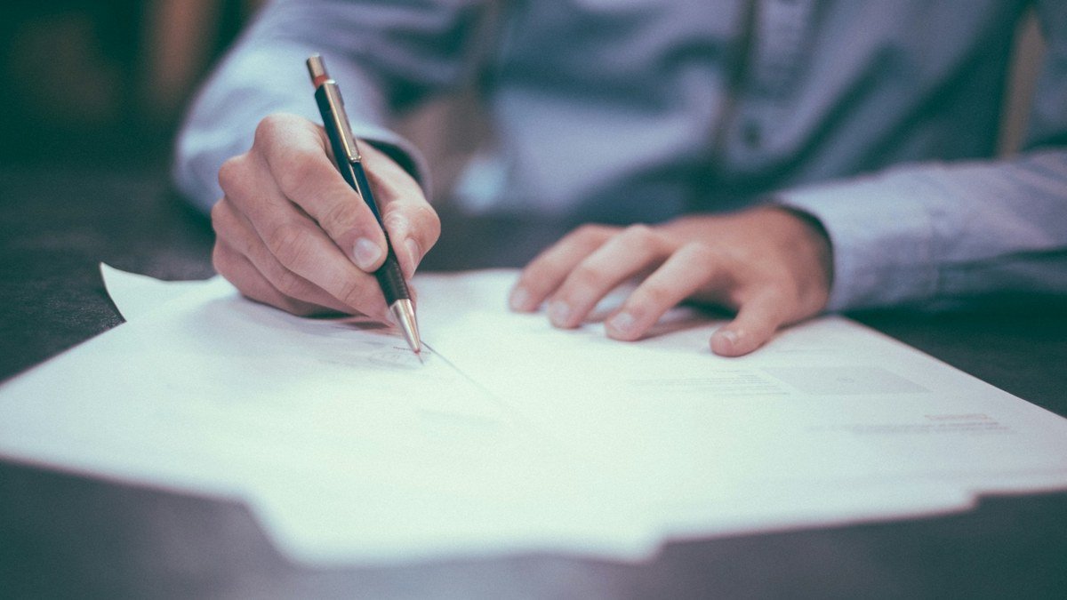 Financial paperwork and calculator used to review small business profit leaks.